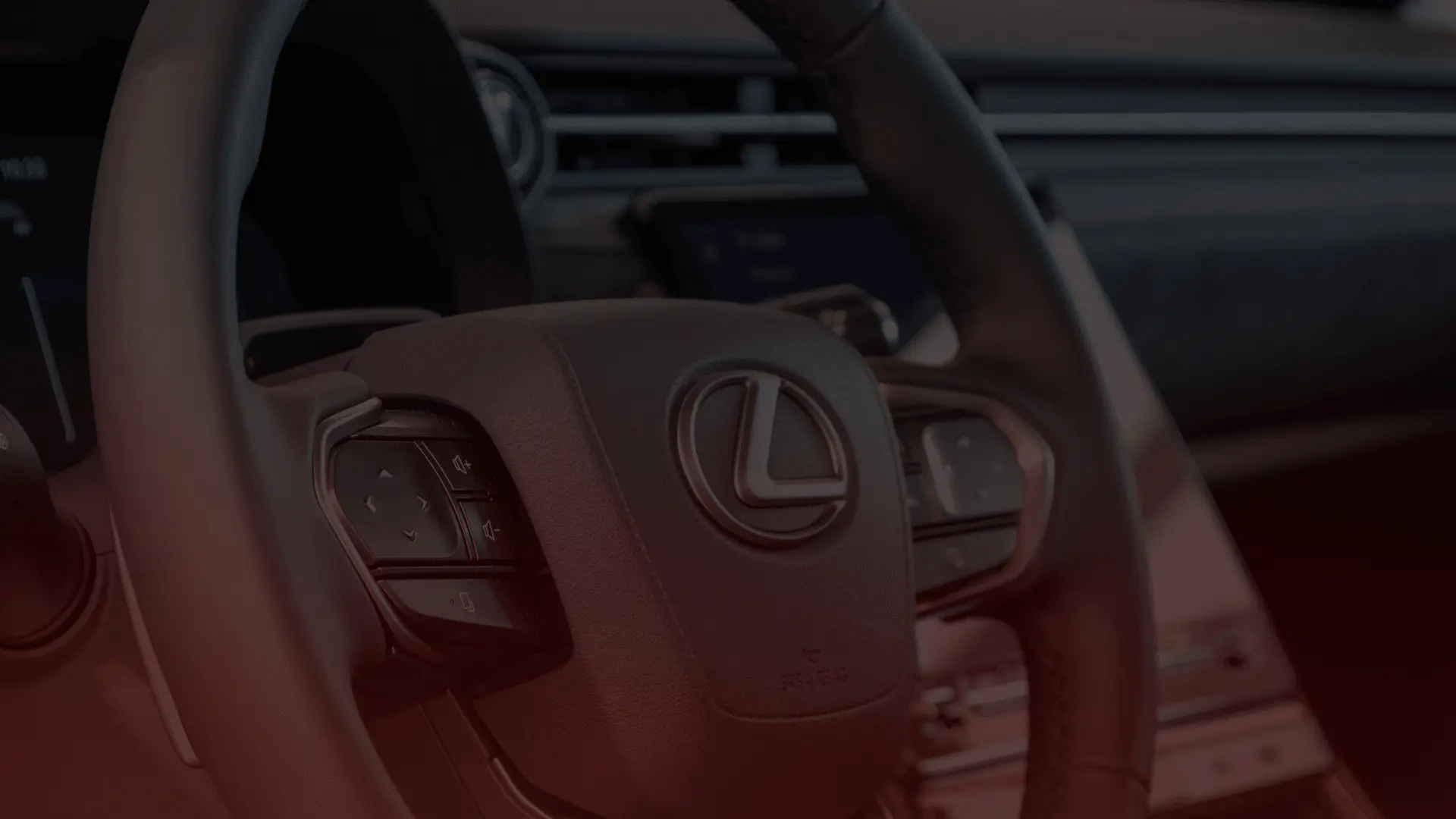 Close-up of a Lexus steering wheel inside a car, showing the logo prominently. The interior features sleek design elements with a partially visible dashboard and controls, exuding a modern and luxurious feel akin to what you might find in an Acura serviced by a top mechanic in Guelph. EuroMechanic | Brock Road Garage Guelph | Top Reviewed Auto Repair Shop in Guelph | Visit brockroadgarage.ca