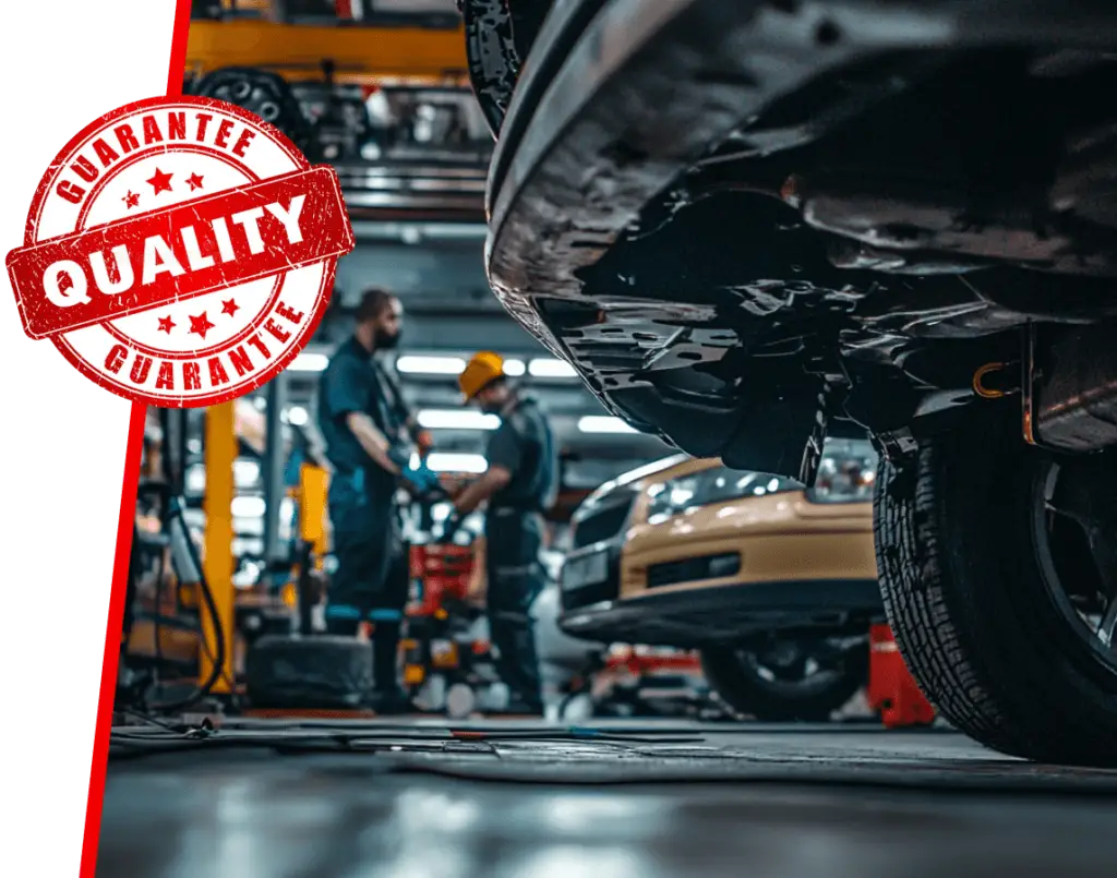 Mechanics at Redline Automotive EuroMechanic focus on the undercarriage of a car, with a red Quality Guarantee stamp prominently featured on the left, ensuring top-notch service quality. Learn more about us and our dedication to exceptional automotive care. Euro Mechanic | Brock Road Garage Guelph | Top Reviewed Auto Repair Shop in Guelph | Visit brockroadgarage.ca